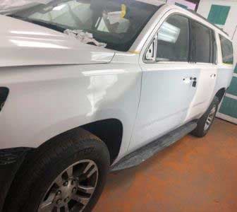 Chevy Suburban before collision repair at TLS Automotive